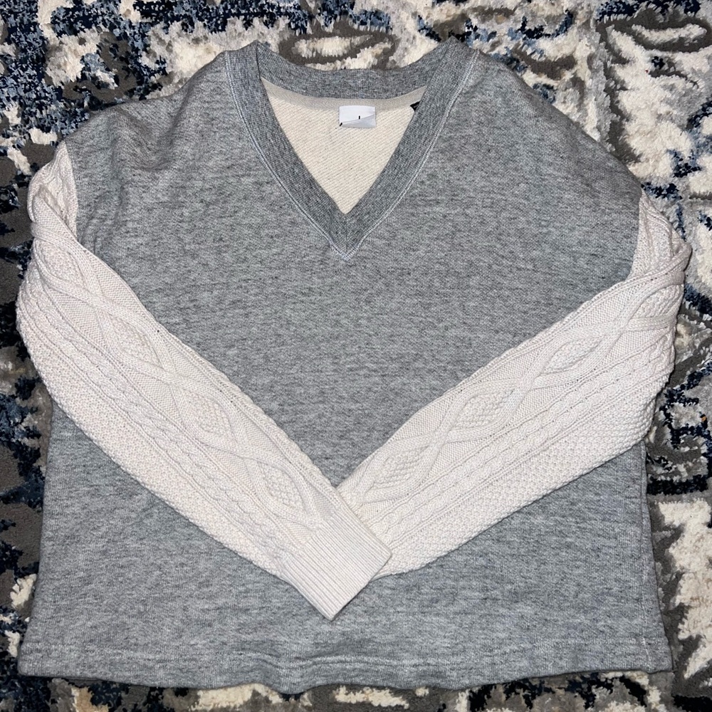 Gray sweatshirt with tan sweater sleeves